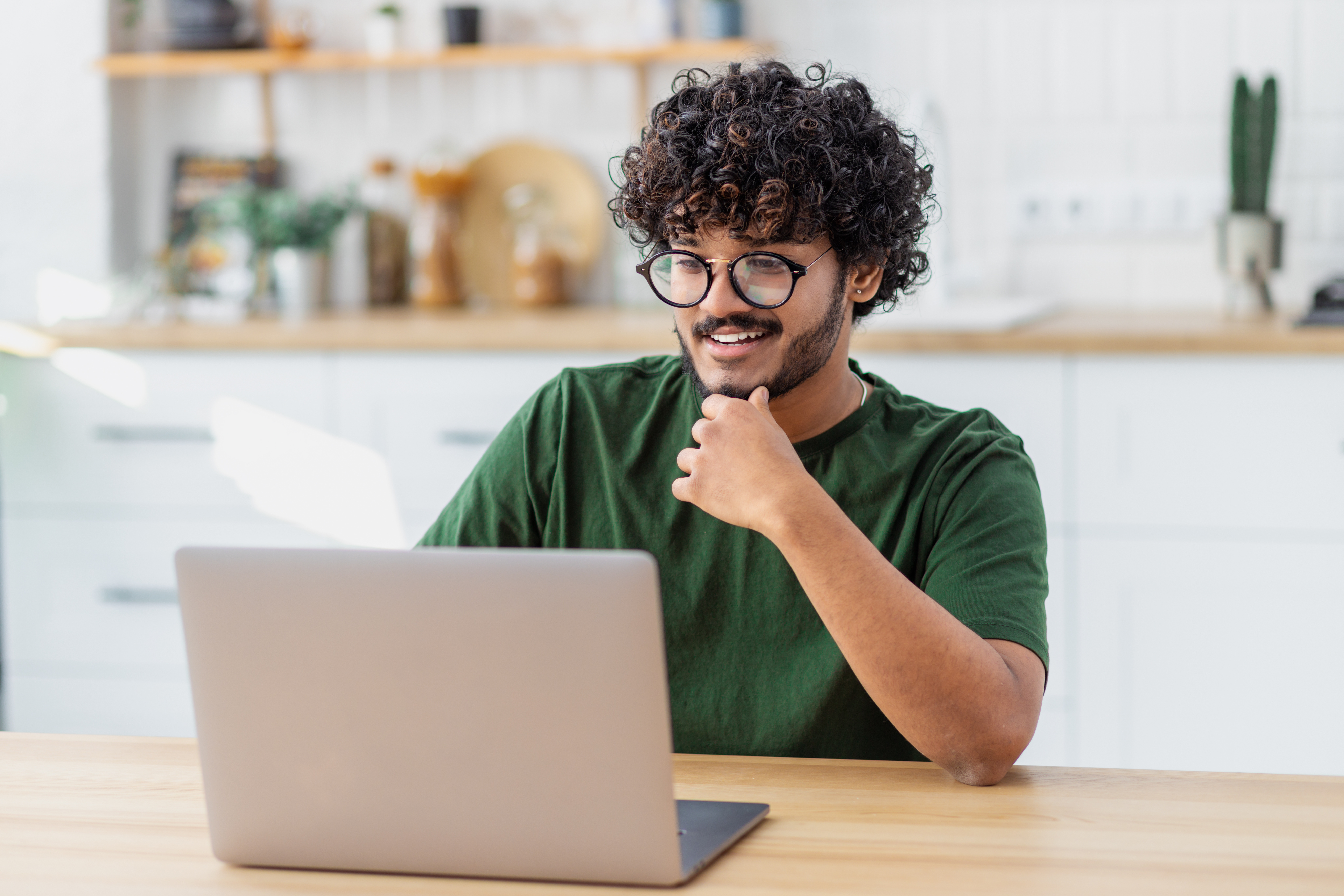 student learning virtually smiling at computer