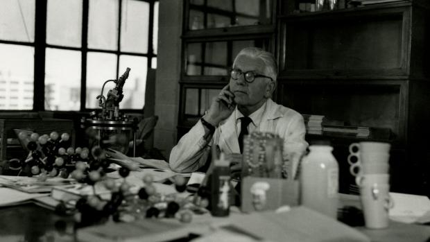 black and white photo of Herman Mark sitting at his desk