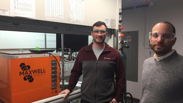 Professor and doctoral student wearing safety glasses in lab