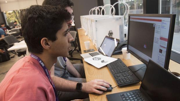 student in the makerspacce using desktop computer