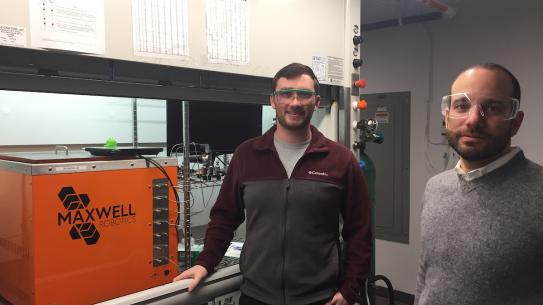 Professor and doctoral student wearing safety glasses in lab