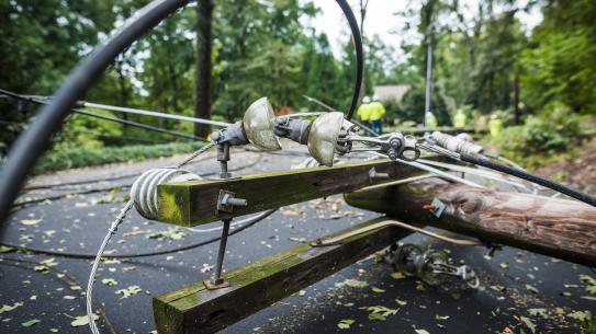 telephone pole knocked down over roadway