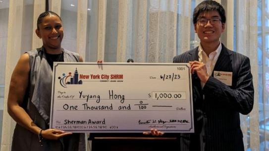 NYU student receiving the Sherman Award