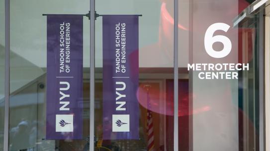 front of building displaying NYU Tandon banner