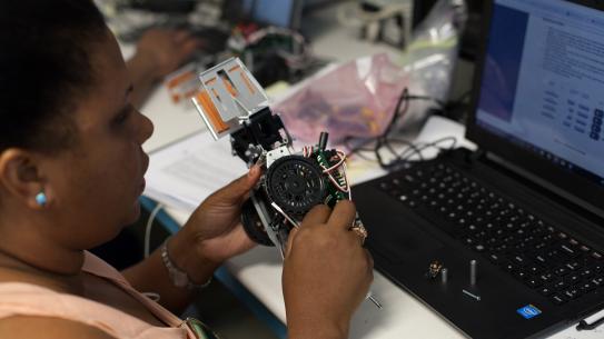 Sherrlyne Gilles working on a robot