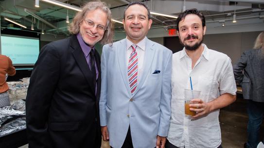 Faculty members and administration gather in the NYU Tandon Markerspace before convocation