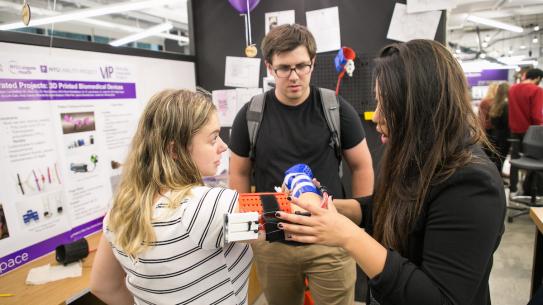 Biomedical Students demonstrating their brace at Makerspace Anniversary