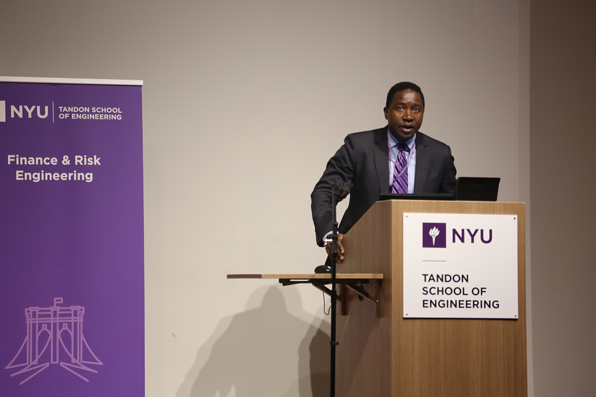 Professor Bruno Kamdem at podium