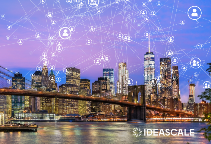 NYC skyline at night with IdeaScale logo