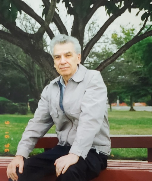 Youla sitting on a park bench